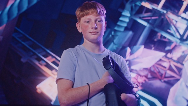 A young boy with a VR headset